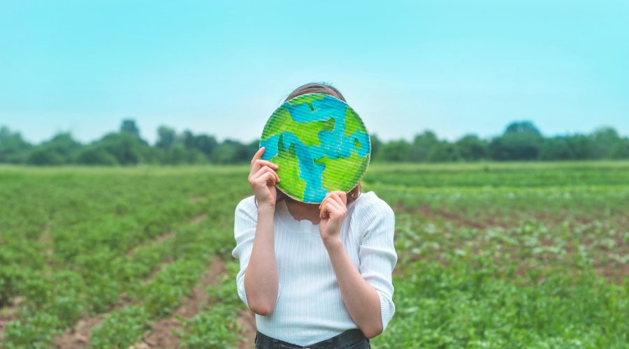 girl holding drawn planet in hands
